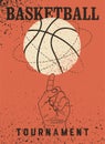 Basketball tournament typographical vintage grunge style poster design. Ball spins on finger. Retro vector illustration. Royalty Free Stock Photo